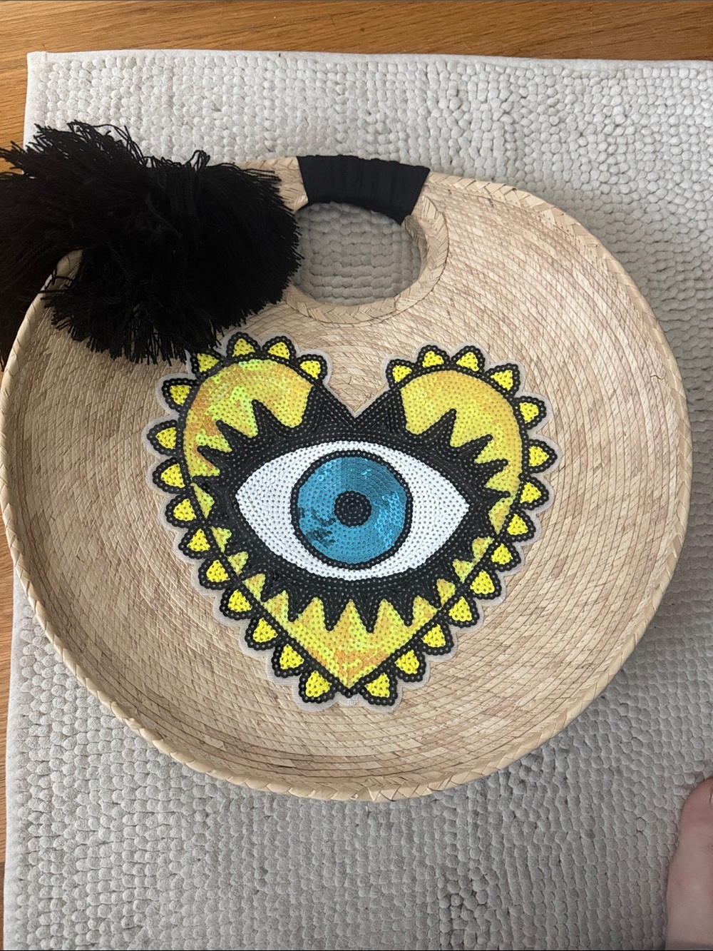 Woman’s  straw Tote with Yellow Heart Eye Sequin Patch and Black Pom Pom